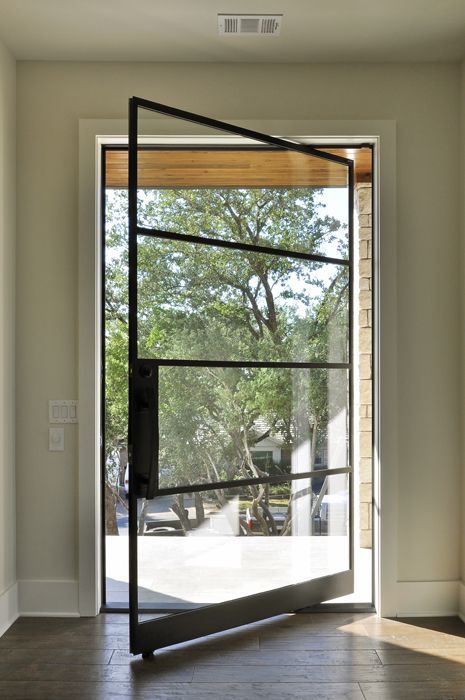 A close-up of an elegant pivot door.