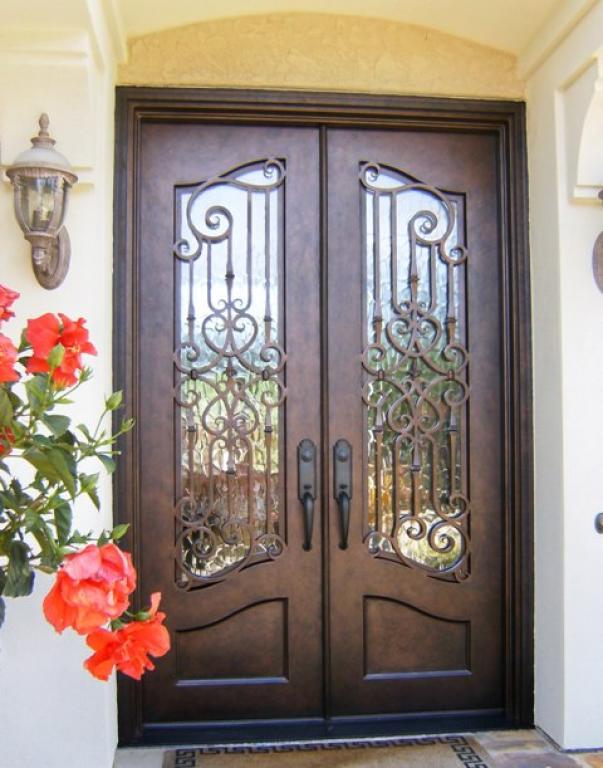 A beautiful wrought iron door installed at home.
